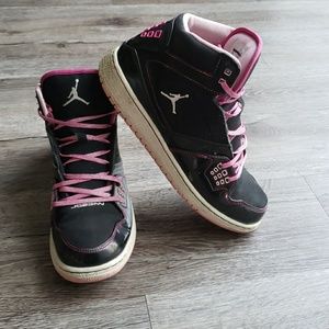 pink and black high top jordans